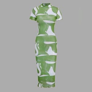 Never worn with tags Micas, mesh green midi dress. Form fitting